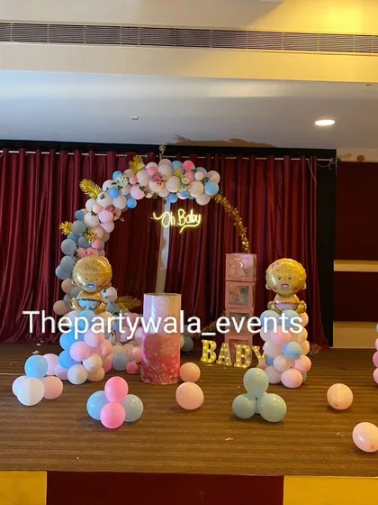 Welcoming a new baby is a huge milestone, and I design baby showers to match the joy. This 'Oh Baby' setup uses a soft pink and blue color scheme, with cute baby-themed foil balloons and a balloon arch, creating a sweet and celebratory space.