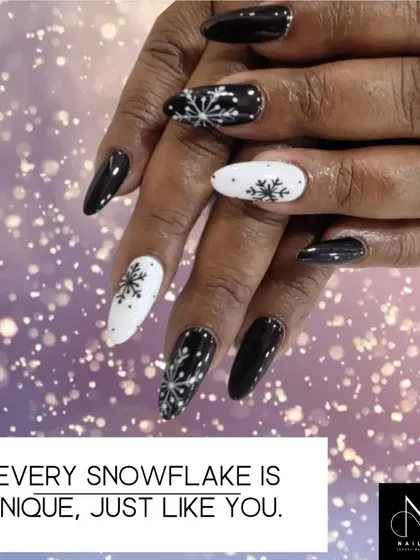 A winter-themed set perfect for the holidays. This design combines glossy black and matte white nails with intricately hand-painted snowflakes.