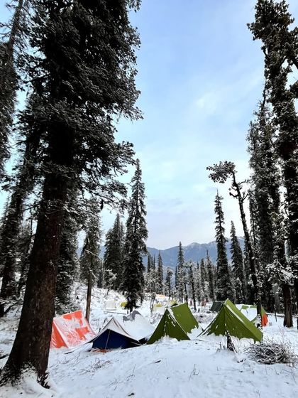 A closer look at our colorful tents pitched in the snow. Waking up to this view is an experience in itself.