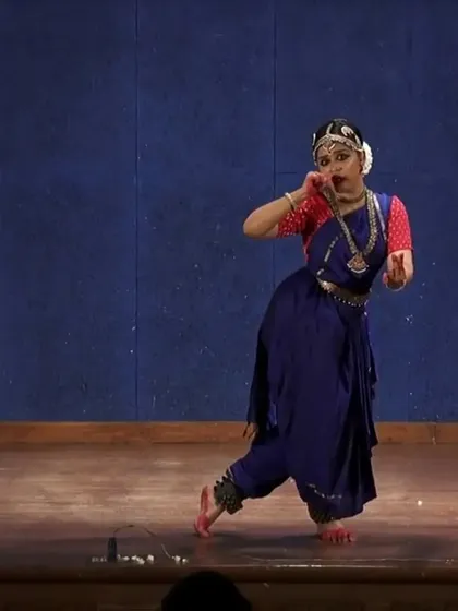 This dynamic pose captures a moment of surprise and emotion in the story. The expressive nature of Bharatanatyam allows for a wide range of feelings to be portrayed, from joy to sorrow.
