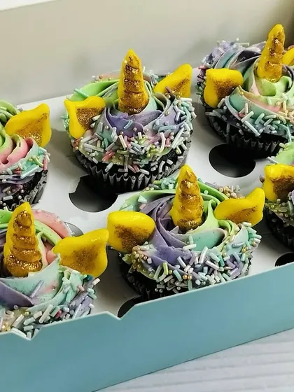 This image shows a box of my unicorn cupcakes ready for delivery. The sturdy packaging ensures that the delicate fondant horns and buttercream swirls arrive perfectly intact for your celebration.