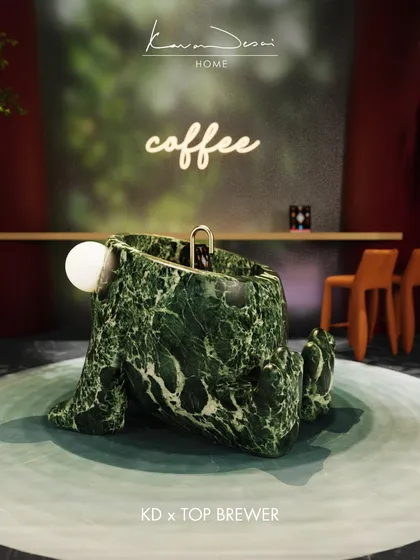Introducing Monster 3.0, a sculptural coffee bar concept carved from a single piece of dramatic green marble. It’s designed to be a functional centerpiece, complete with an integrated coffee brewer, proving that even everyday rituals can be artistic.