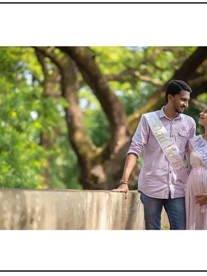 This couple looks so happy and proud in their "Mom to be" and "Dad to be" sashes.