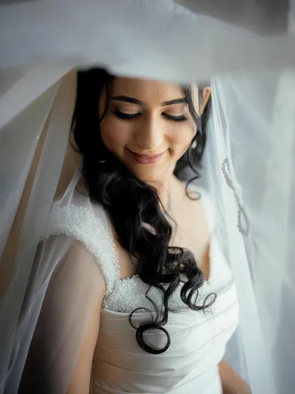 This ethereal look for my Christian bride is all about soft, romantic beauty. I used a light touch to create luminous skin and gentle definition on the eyes, perfectly complementing her delicate veil and white gown for a truly angelic appearance.