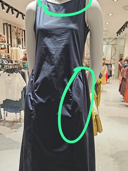 Part of the transformation process involves identifying silhouettes that don't work. Here, we see how a shapeless dress can add unnecessary bulk, which we corrected with more structured pieces.