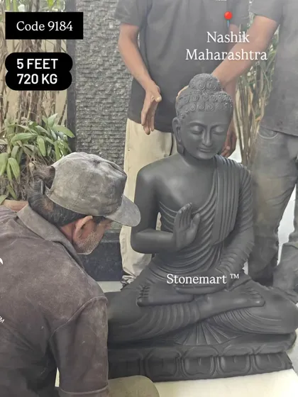 The 3-foot black marble Buddha statue being prepared for packing. Our team ensures every piece is flawless before it is shipped.