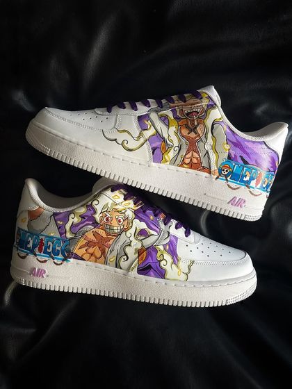 A full view of the Luffy Gear 5 custom sneakers, showcasing the detailed character art and One Piece logo on classic white Air Force 1s.