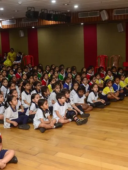 Addressing a large auditorium at Sushila Birla Girls’ School. My portable setup allows me to transform any space, big or small, into a stage for stories.