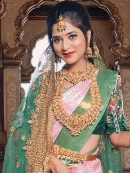 A beautiful shot of a bride with a delicate veil, wearing our complete temple jewellery set.