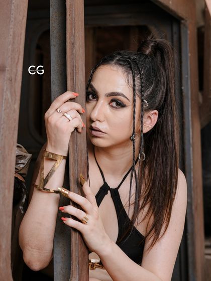 I got my eyes set on you. A close-up portrait from the junkyard shoot, focusing on the intense makeup and unique hair styling.