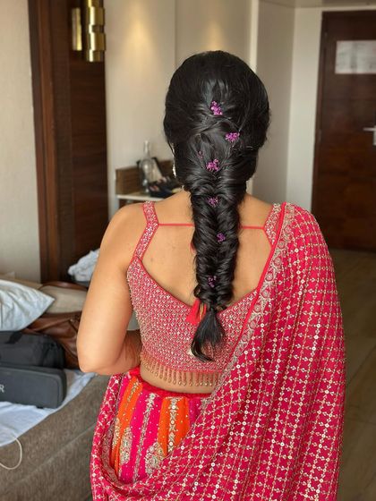 Another view of the simple messy braid, showing how it provides a relaxed yet put-together look for any pre-wedding function.