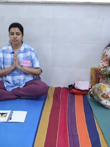 Students in our meditation training program hold Anjali Mudra (Prayer Pose). This gesture helps to center the mind and cultivate a sense of gratitude and reverence for the practice.