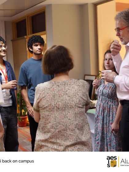 Alumni and faculty engage in conversation during a back-to-campus reunion. These events are filled with shared stories and rekindled friendships.