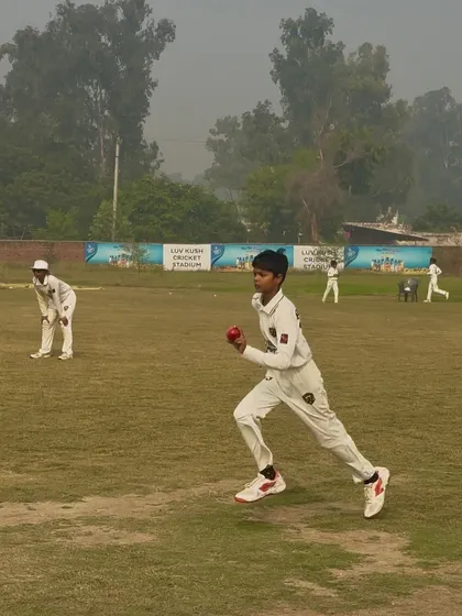 A fielder running in to celebrate a wicket.