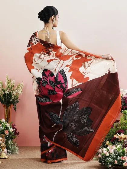A repeat of the brown abstract floral saree, a bold and modern choice.