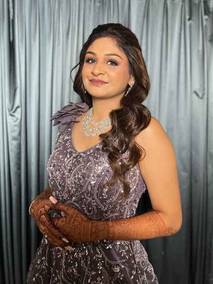 A portrait of Jhanvi, looking elegant and chic for her cocktail night. The makeup is understated yet glamorous, perfect for the occasion.