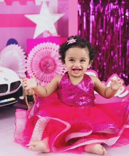Let's create a fairytale with a Barbie-themed shoot. Full of pink, sparkle, and fun props like a miniature car, it's a perfect way to celebrate your little one's vibrant personality.