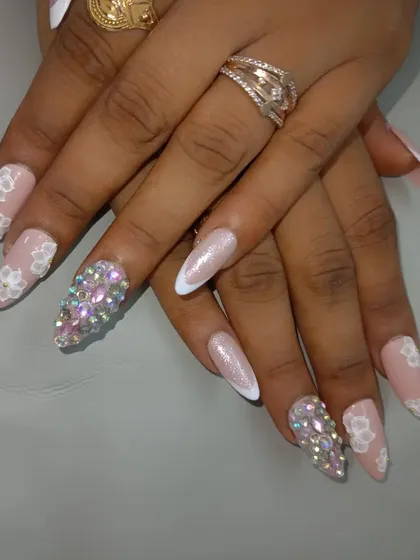 Another angle of the rhinestone and 3D flower bridal set, showing how it catches the light. These are designed to be the ultimate accessory for your special day.