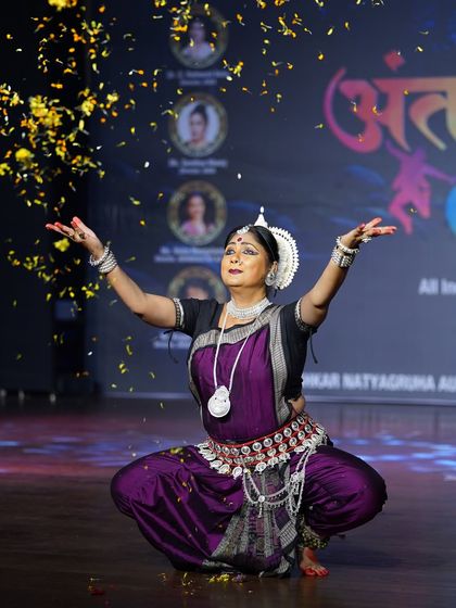 Odissi exponent Puspita Mishra during her special performance at Antaranga. The shower of petals adds a magical touch to her graceful and sculptural pose.