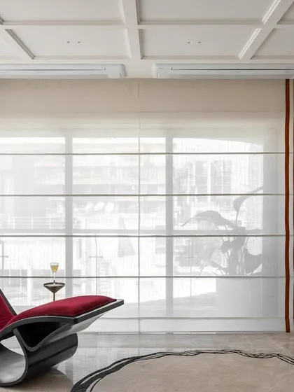 This corner of the Evelyn lounge features a sculptural red chaise lounge and our viral statement bar unit. It’s a perfect spot for relaxing with a drink, surrounded by unique, custom-designed pieces.