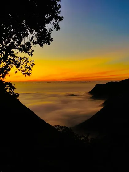 A stunning sunrise view from our Munnar campsite.