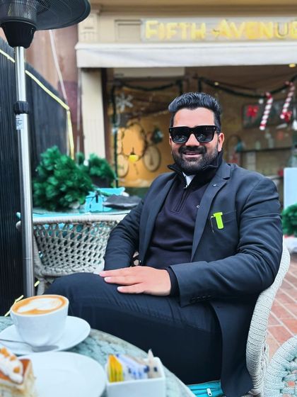 Enjoying a coffee at an outdoor cafe. I believe that in this world, some things will work for you and some against you; the key is to keep moving.