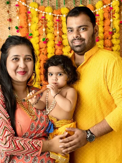 A complete family picture with their little Krishna. These portraits become treasured heirlooms, celebrating both family and festival.