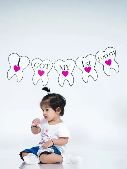A wider shot showing the fun, interactive nature of our "First Tooth" photoshoot.