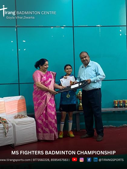 A young participant being awarded her certificate and medal. I ensure every child's effort is recognized to encourage continued participation in sports.