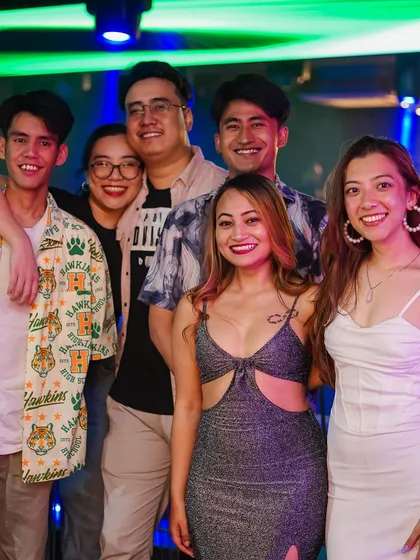 A group of friends posing for a photo.