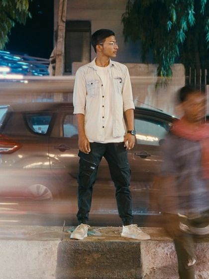 "Every picture tells you a different story." A long-exposure shot on the street, capturing the motion of life around a still moment.