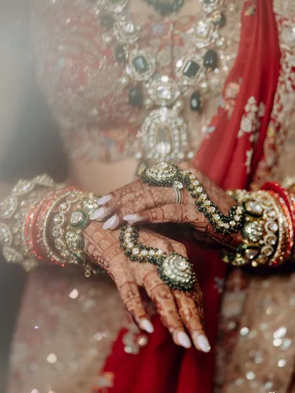 The beauty is in the details. For Nikita's wedding look, we focused on delicate hand accessories and classic polki jewellery, ensuring every single element flowed together seamlessly for a graceful and elegant finish.