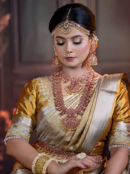 This is a beautiful ruby temple jewellery set. The deep red stones give a rich, traditional feel, and the set includes a choker, haram, and vaddanam.