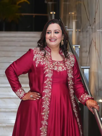It brings me immense joy to see my clients shine in our curated pieces. This elegant maroon anarkali, with its delicate floral embroidery and flattering silhouette, embodies the quiet glamour I cherish.