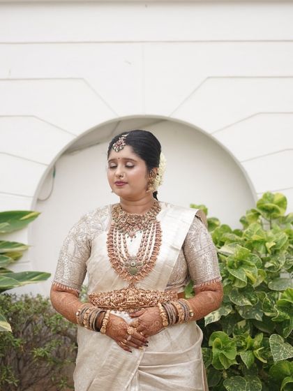 A serene portrait of the bride. Her makeup features soft, earthy tones that enhance her natural beauty.