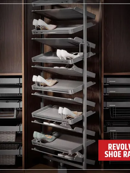 A detailed look at the revolving shoe rack integrated into a custom wardrobe. This solution is perfect for utilizing corner spaces or tall cabinets, holding numerous pairs in a compact footprint.