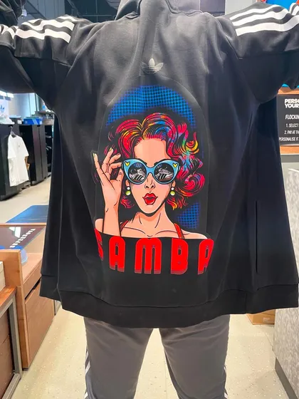 It’s not just about sneakers. We also create custom apparel, like this Adidas hoodie featuring a bold, colorful pop-art design. This service is perfect for creating exclusive event merchandise.