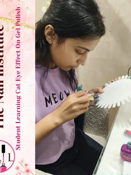 Learning the cat eye effect. This student is using a magnet to create the signature shifting line in the gel polish.