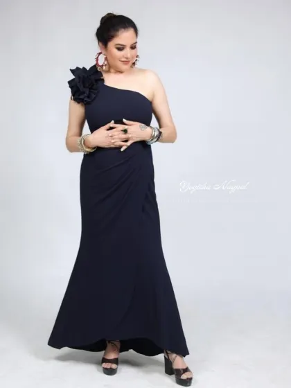 Smokey eyes and a black dress are a classic combination for endless confidence. This look was for a beautiful fashion designer.