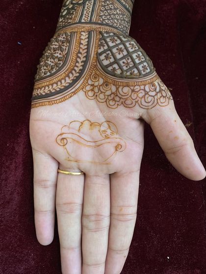 The initial outline for a baby shower design, showing how even pictorial elements start with a simple sketch.