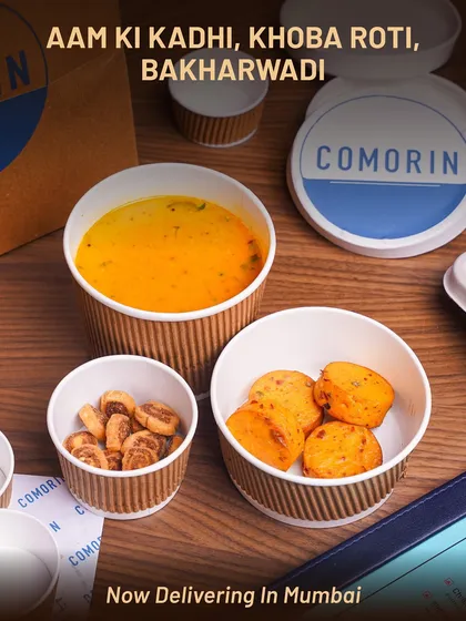 A comforting bowl of Aam ki Kadhi, delivered with crispy Khoba Roti and savory Bakharwadi. This meal balances tangy, sweet, and spicy flavors, making it a perfect light yet satisfying option.