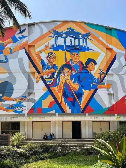 We transformed the massive 50-foot auditorium wall at MVJ College of Engineering into a vibrant story of student life. This colorful mural celebrates the energy and dreams of the campus, creating a landmark that inspires students every day.