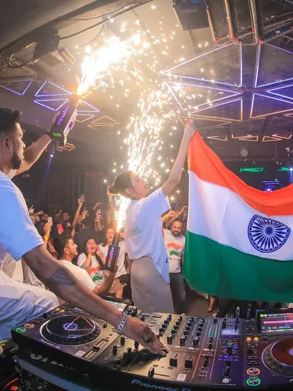 Bringing patriotic energy to the dance floor. Celebrating Republic Day with the Indian flag and a bottle popper, creating a proud and unforgettable moment for everyone in the club.
