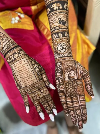 Your wedding vows, beautifully written in henna. This is a wonderfully personal way to carry your promises with you, surrounded by intricate peacock and floral details.