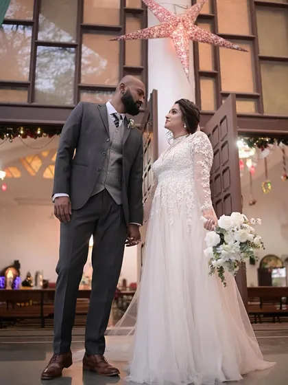 An elegant and classic look for a beautiful Christian wedding. The makeup is soft and romantic, paired with a sophisticated updo to complement her stunning white gown and veil.