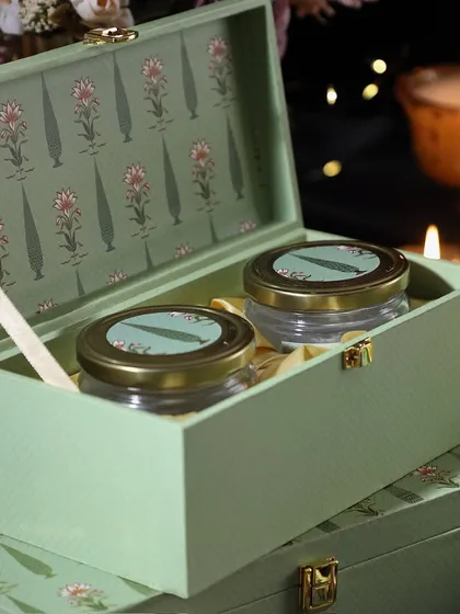 This unique hamper features two of our specialties in a beautiful floral box: crunchy rose petal cashews and mini butter cookies. A delightful combination of flavors.