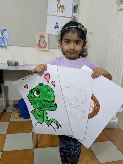 Uvika, age 5, showing her wonderful collection of drawings. Her portfolio includes a friendly dinosaur, a cute puppy sketch, and other imaginative creations.