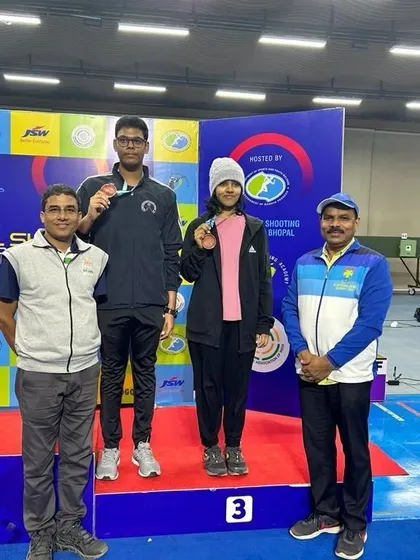 Pranavi and her partner on the podium after winning the Bronze Medal in the 10m Air Pistol Junior Mixed Event.