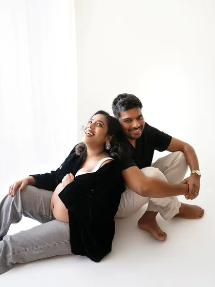 Just a happy couple, excited for their new adventure. This relaxed, back-to-back pose is so full of joy and connection.