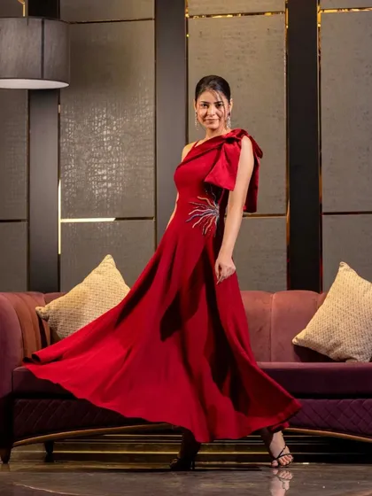 For evening wear, I focus on capturing movement and glamour. This studio shot uses precise lighting to showcase the flow and form of the gown, creating a dramatic and elegant image ideal for designer collections.